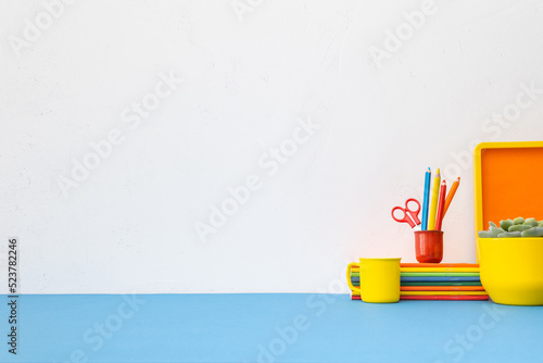 Learning place. Desk mock up with set of colorful school supplies. Back to school.