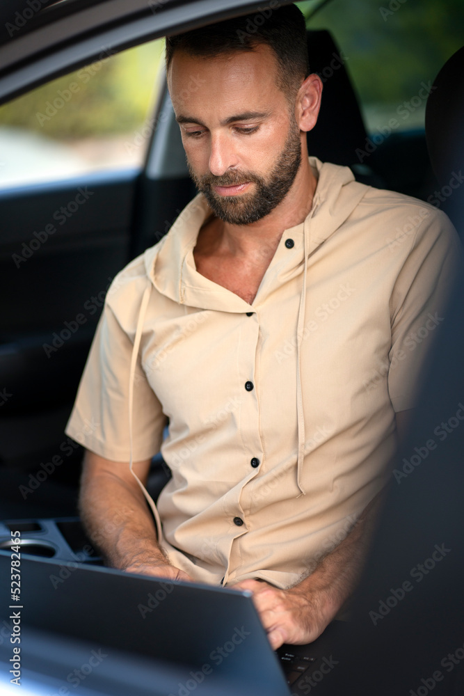 Car mechanic using laptop computer making car diagnostic. Repair, car service concept Car mechanic using laptop computer making car diagnostic. Repair, car service concept
