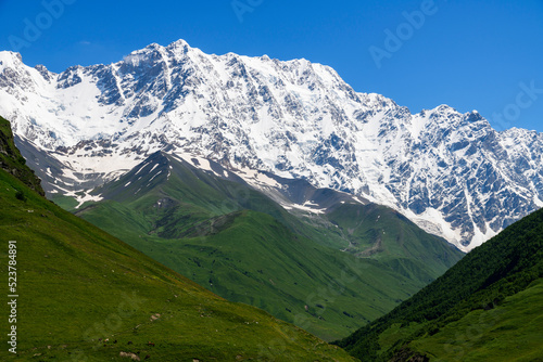 Shkhara mountains, the highest point in the nation of Georgia It is located near the Russian-Georgian border, in Russia's Kabardino-Balkaria region. Beautiful snow covered mountains.