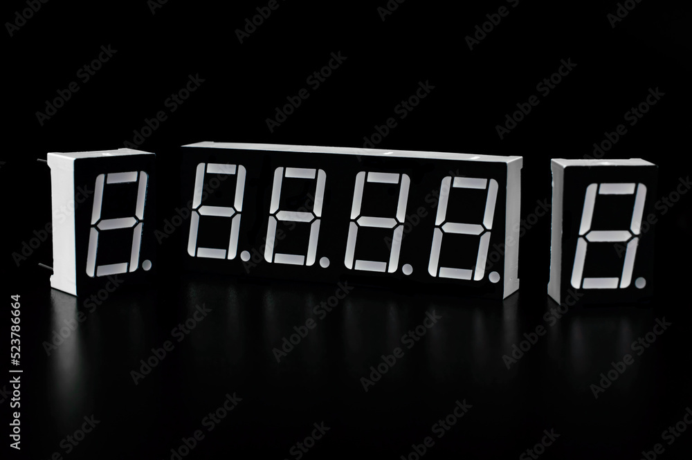 Seven segment indicators on a black background. Background picture. Arduino project concept. Seven segment indicators on a black background. Background picture. Arduino project concept.