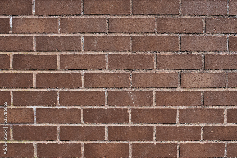 The texture of a neat brown stone. Smooth brickwork with brown smooth stone. The texture of the wall of the English house. The texture of a neat brown stone. Smooth brickwork with brown smooth stone. The texture of the wall of the English house.