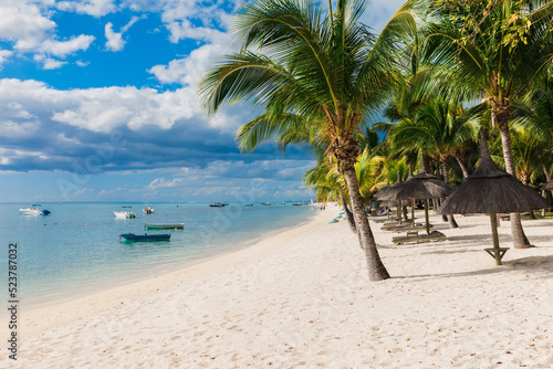Fototapeta Naklejka Na Ścianę i Meble -  Beautiful view of tropical beach in Mauritius. Transparent ocean, beach, coconut palms and blue sky