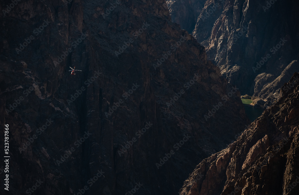 Helicopter Flies Below The Rim In The Grand Canyon