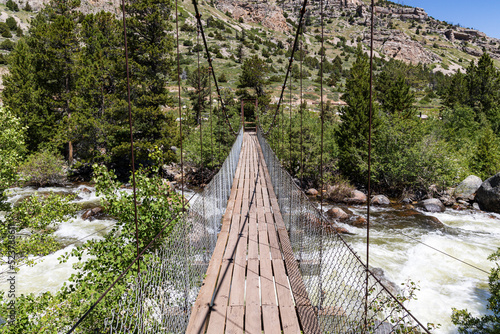 Suspension bridge over the Middle Popo Agie River at Sinks Canyon, Lander, Wyoming, USA