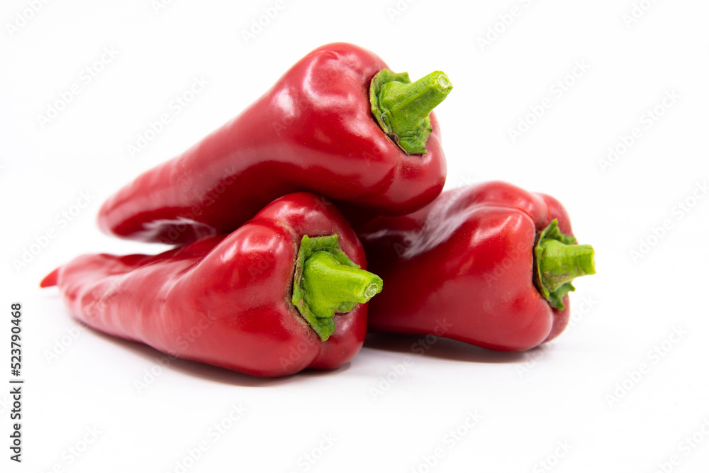 Red Peppers isolated on white. Capia or chili red peppers on white background. Red Peppers isolated on white. Capia or chili red peppers on white background.
