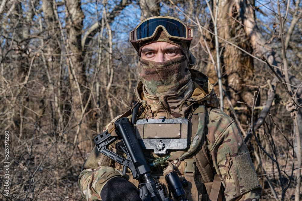 Male modern soldier in the autumn forest Male modern soldier in the autumn forest