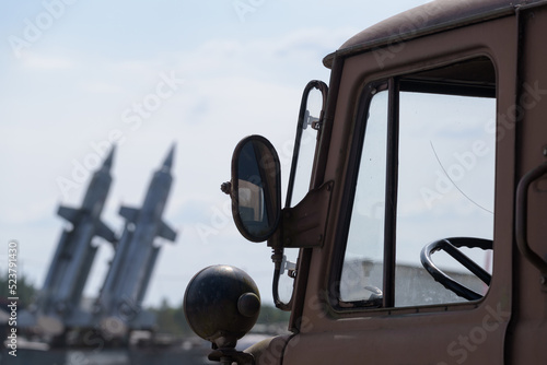 ARMED FORCES - The cabin of a Soviet military vehicle and a set of Russian anti-aircraft missiles in the background 