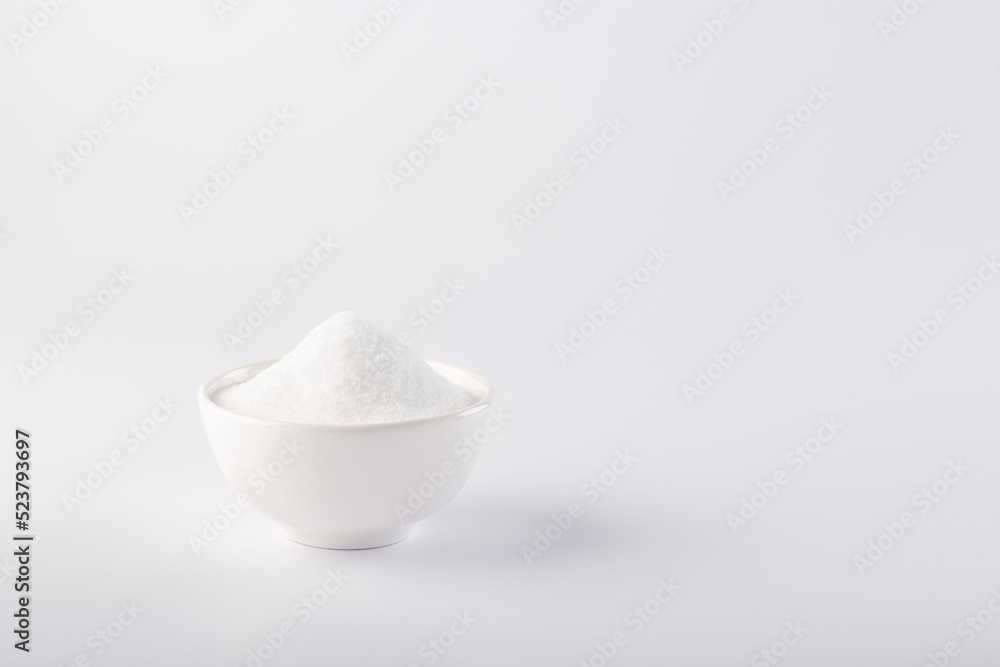 Sugar substitute in a bowl. Close-up horizontal photo of a sugar substitute on a white background in a white bowl. Stevia. Sugar substitute in a bowl. Close-up horizontal photo of a sugar substitute on a white background in a white bowl. Stevia.