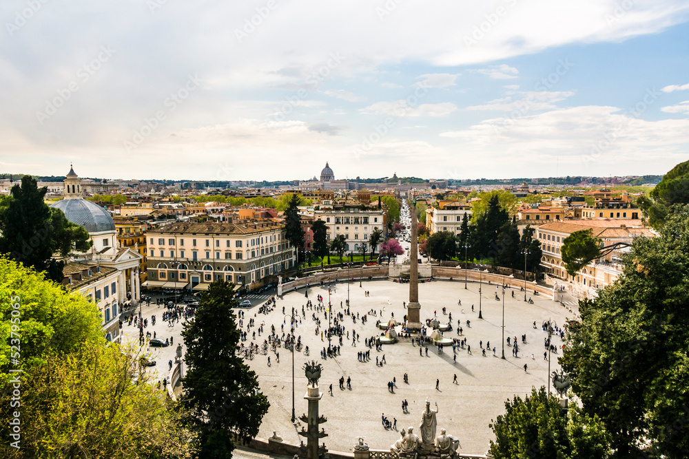 View of the Piazza del Popolo with people walking and blue sky. Rome City, Italy