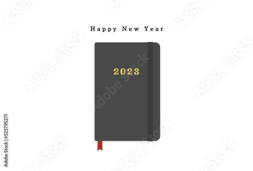 happy new yearの文字と2023年の刻印が入った黒い手帳の年賀状

