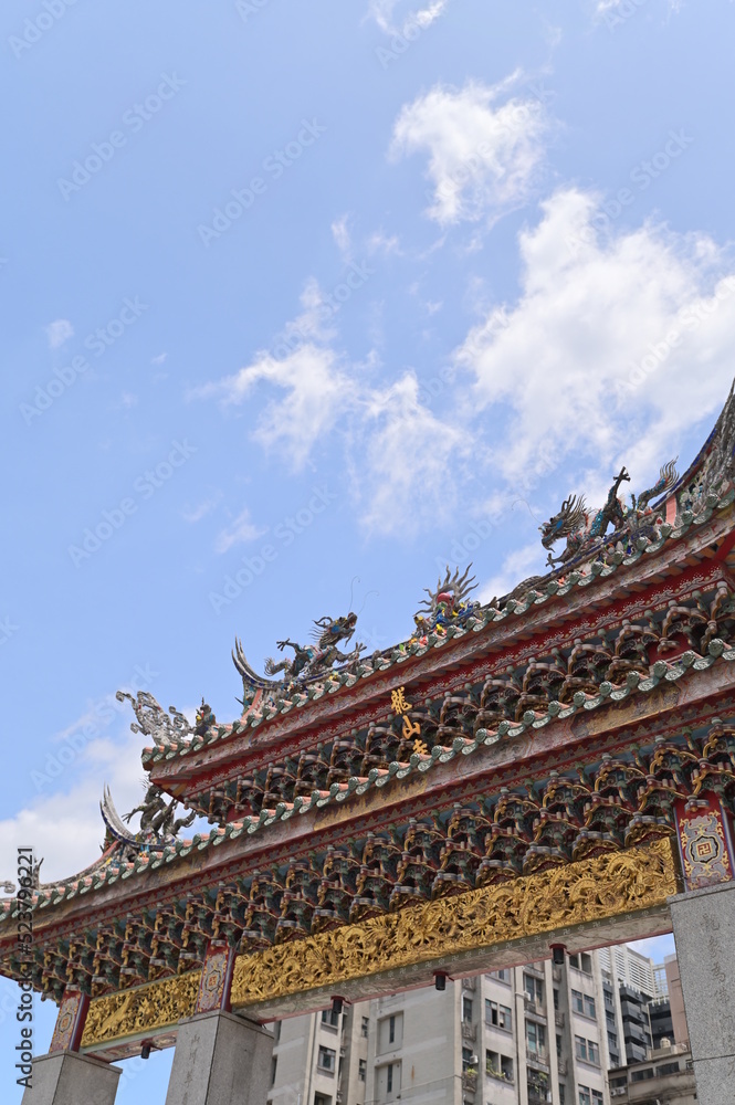 Taipei - July 17, 2022: Shot of the entrance of Longshan Temple in Taipei on a sunny day.