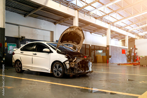 car repair in garage service station with soft-focus and over light in the background