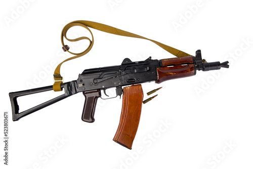 kalashnikov rifle with ammunition on white background photo