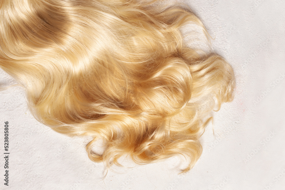 Beautiful healthy wavy long hair on white background