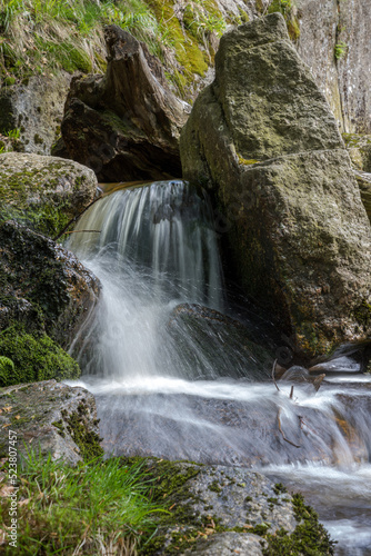 cascade on a mountain stream - water in motion - long exposure