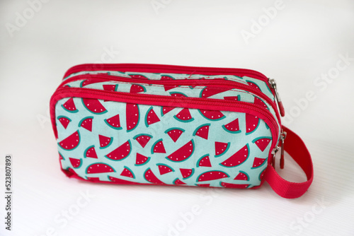 Wallpaper Mural School supplies pencil case with watermelon design. Fabric bag with closure. Pencil bag. Watermelon texture. Isolated white. Student accessory. Accessory to take to school. Torontodigital.ca