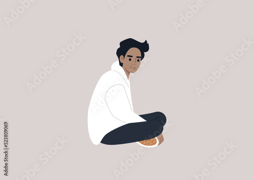 A young male Caucasian character sitting on the floor with their legs crossed