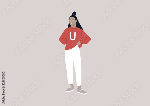 A young cheerful female Asian student wearing a university jersey, college life