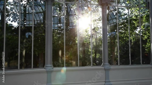 sun entering through glass of the glass palace in madrid
