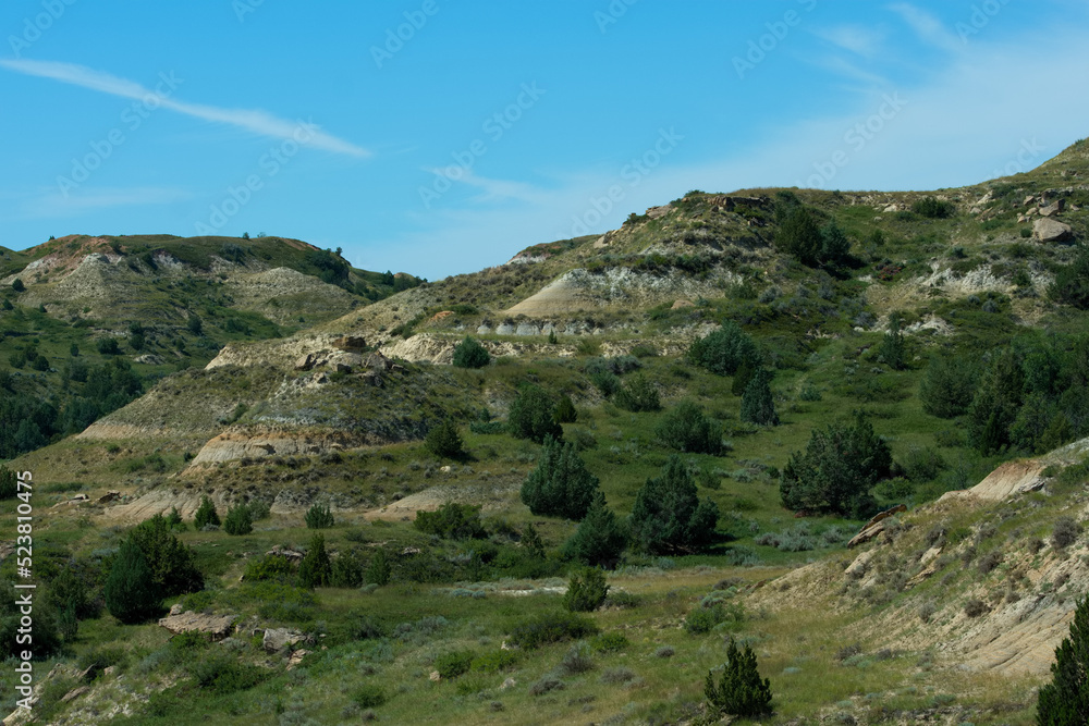 Naklejka premium Multi colored and layered rock hills at Theodore Roosevelt National Park