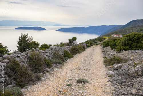 Old road near Predoscica on a cloudy day in springtime