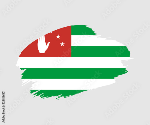 Abstract creative painted grunge brush flag of Abkhazia country with background