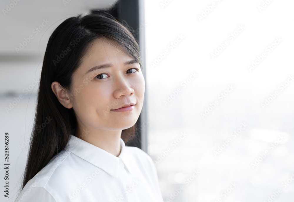 Asian woman in white shirt