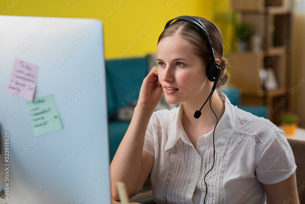 Beautiful young operator woman working with laptop and wearing headseat happy face smiling with crossed arms looking at the camera. Positive person Beautiful young operator woman working with laptop and wearing headseat happy face smiling with crossed arms looking at the camera. Positive person