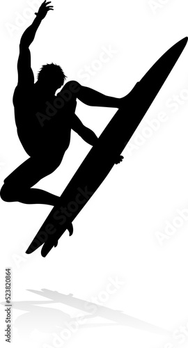 Photography A high quality detailed silhouette of a surfer surfing the waves on his surfboar
