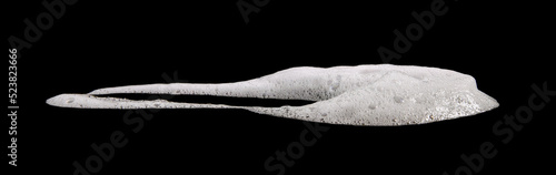 Fotografie white foam from soap isolated on a black background