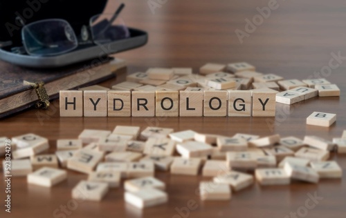 Fotografia hydrology word or concept represented by wooden letter tiles on a wooden table w