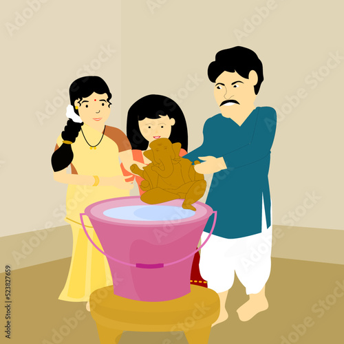 Indian family holding Ganapati idol before immersion into the water, celebration of Ganapati Visarjan at home, during Ganesh Chaturthi Hindu festival.	