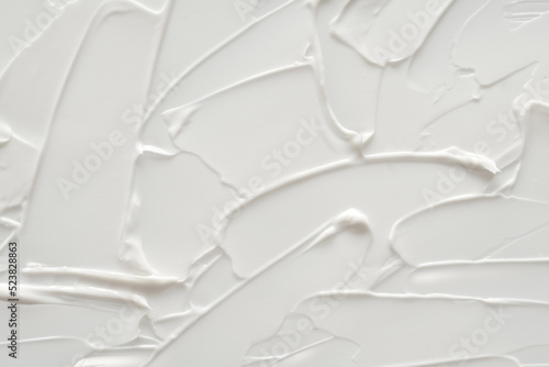 Fototapeta Naklejka Na Ścianę i Meble -  Creamy foundation texture isolated. Smear of face cream isolated. Texture of cream background