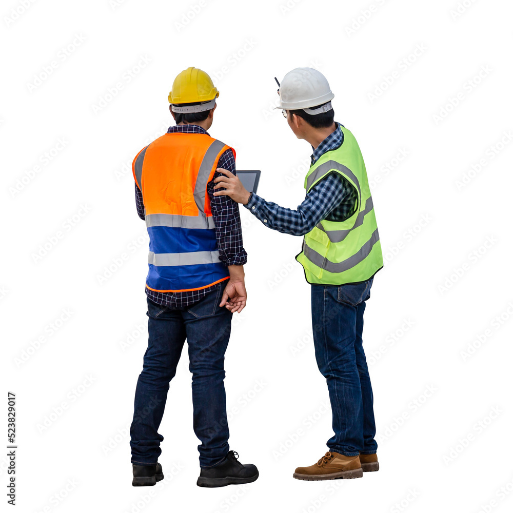 Engineer and foreman worker checking project at building site, Engineer and builders in hardhats discussing on construction site Engineer and foreman worker checking project at building site, Engineer and builders in hardhats discussing on construction site