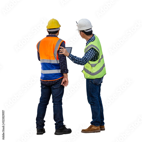 Engineer and foreman worker checking project at building site, Engineer and builders in hardhats discussing on construction site photo