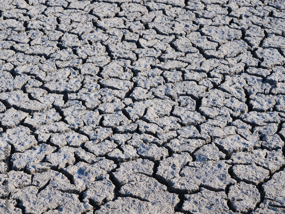 A close-up on cracked earth. Batz-sur-Mer, France. A close-up on cracked earth. Batz-sur-Mer, France.