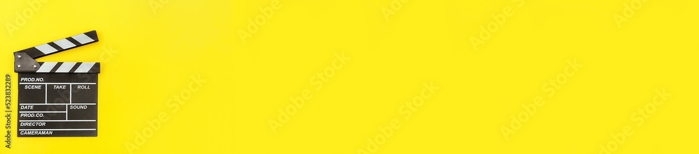 Filmmaker profession banner. Classic director empty clapperboard or movie slate isolated on yellow background. Video production film cinema industry concept. Flat lay top view copy space mock up