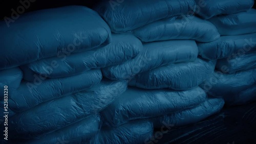 Drug Bags Piled Up In Dark Room photo