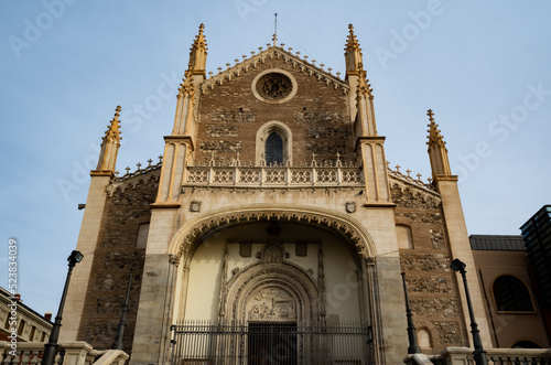 church in the park with blue sky and green field in madrid spain europe