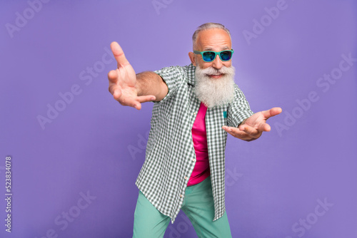 Photo of crazy overjoyed aged person dance hands invite you isolated on violet color background