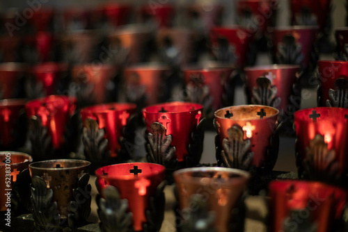 Canvas Print Close up of votive candle rack in a catholic cathedral in New Mexico