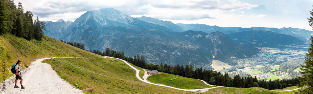Web banner of the mountains. A Man is Hiking in the alps, at Jenner. Mountain panorama - Berchtesgaden Alps, Germany, Bavaria, Schoenau am Koenigssee