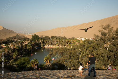 tourists in the desert Huacachina peruvian oasis ,Ica