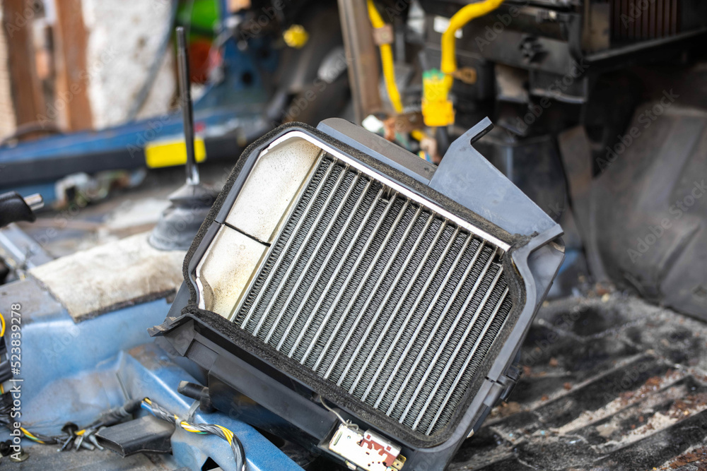 repair and installation of a new car interior heater radiator ...