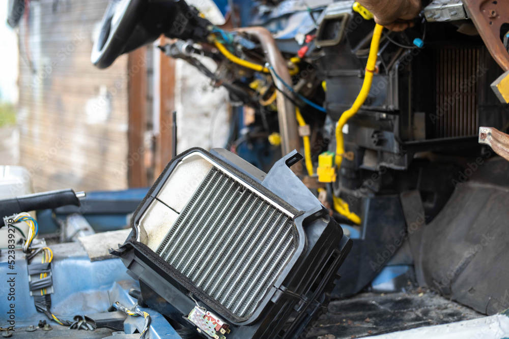repair and installation of a new car interior heater radiator ...