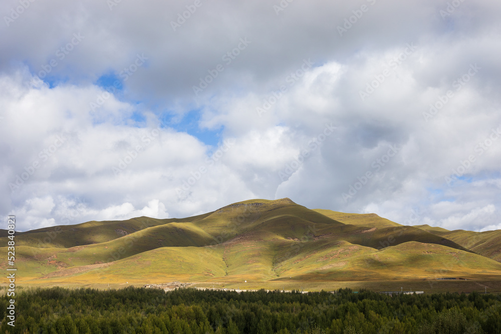 Grassland hill in western Sichuan on Tibetan Plateau Grassland hill in western Sichuan on Tibetan Plateau
