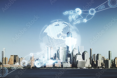 Double exposure of abstract virtual robotics technology with world map hologram on New York city skyscrapers background. Research and development software concept