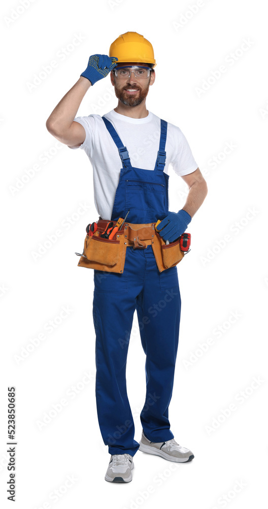 Professional builder in uniform with tool belt isolated on white Professional builder in uniform with tool belt isolated on white