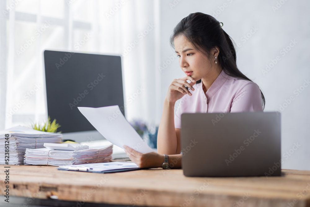 Business Documents, Auditor business Asian woman checking searching document legal prepare paperwork report analysis TAX time, accountant Documents data contract partner deal in the workplace.
Business Documents, Auditor business Asian woman checking searching document legal prepare paperwork report analysis TAX time, accountant Documents data contract partner deal in the workplace.