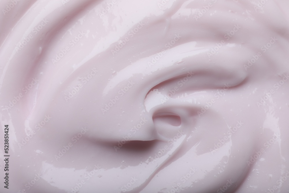 Closeup view of light pink body cream as background Closeup view of light pink body cream as background